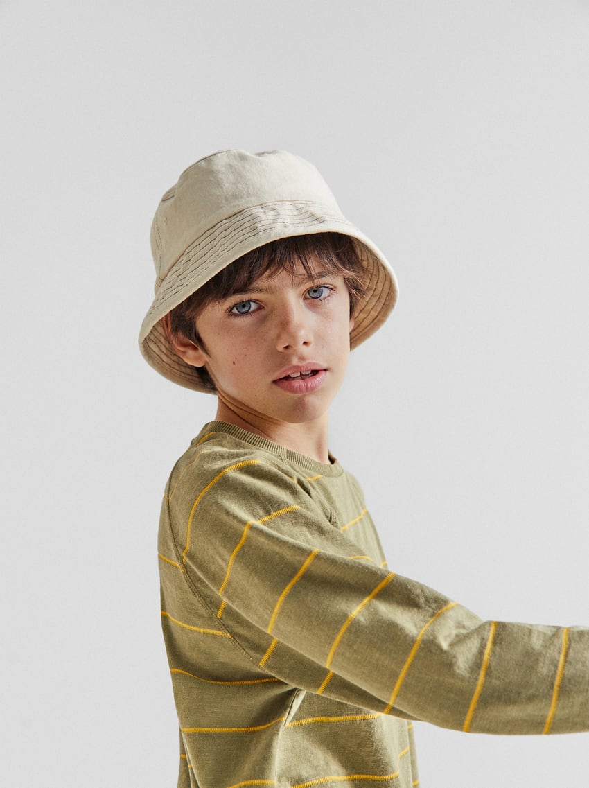 Boy hat and green shirt